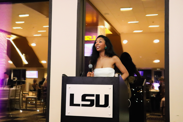 student speaking into microphone
